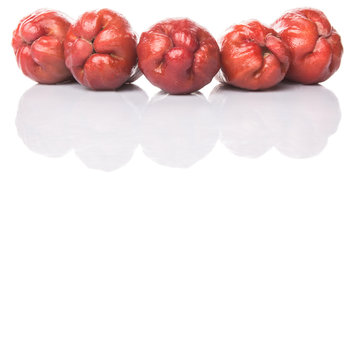 The exotic rose apple fruit over white background