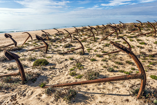 Cemetery of anchors on the beach at Praia Do Barril in Santa Luz