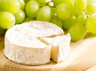 Still life of cheese and grapes
