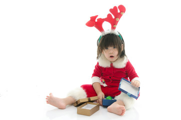 Cute asian baby wearing santa costume with present