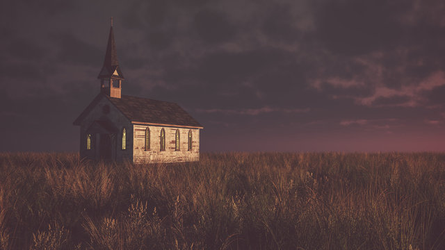 Old abandoned white wooden chapel on prairie at sunset with clou