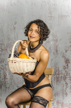 Attractive Mulatto Woman  In A Lingere With A Basket Of Fruit