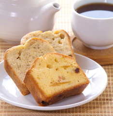 Sponge fruit cake and cup of tea