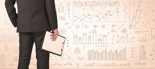 Businessman with diagrams and graphs