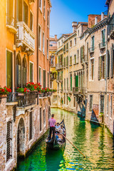 Fototapeta na wymiar Gondola on canal in Venice, Italy