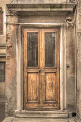 Fototapeta na wymiar old wooden door in Venice, Italy