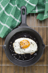 fried egg in a cast iron pan