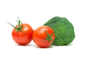 ripe tomatoes and broccoli isolated on white background close-up