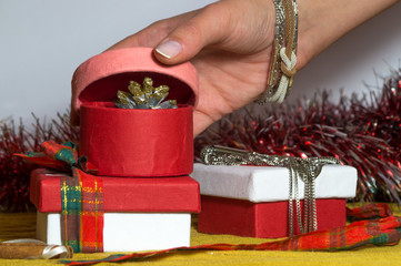 Pink paper Christmas box is being opened