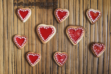 Red hearts cookies on wooden background