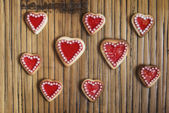 Red hearts cookies on wooden background