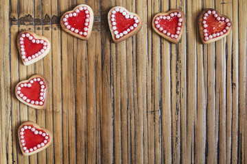 Red hearts cookies on wooden background