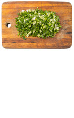 Spring onion or scallions on wooden cutting board 