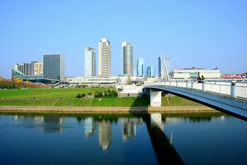 Fototapeta na wymiar Vilnius city skyscrapers and walking bridge view