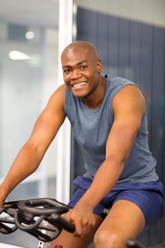 African American Man Sitting On A Stationary Bike