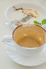 Empty coffee cup and empty dish