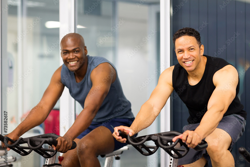 Wall mural fitness guys biking in gym