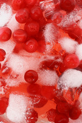 Cocktail with cranberry juice and ice cubes close up