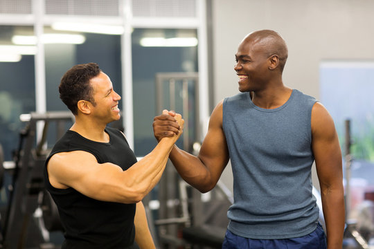 men handshaking in gym