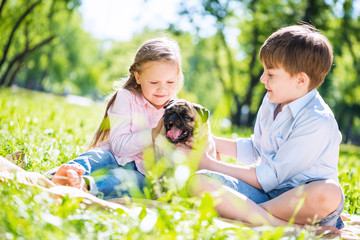 Children in park with pet