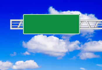 Road sign over blue sky