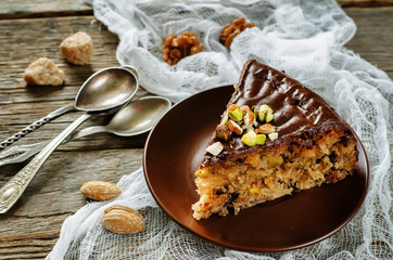 cake with nuts, chocolate chips and chocolate glaze