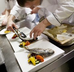 Chef in restaurant kitchen cooking