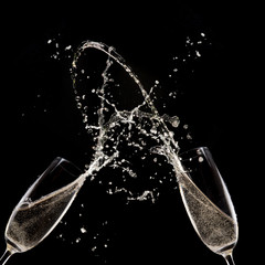 Champagne flutes on black background