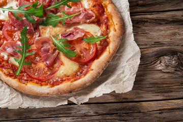 Delicious italian pizza served on wooden table
