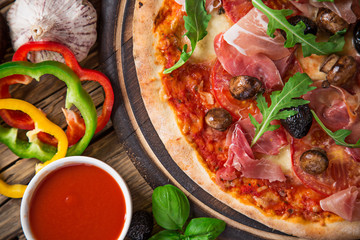 Delicious italian pizza served on wooden table