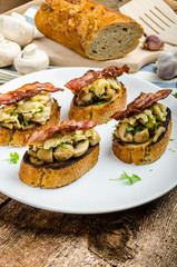 Rustic breakfast - bread toast, mushrooms, eggs