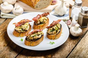 Rustic breakfast - bread toast, mushrooms, eggs