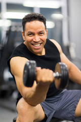 man working out with dumbbell