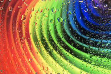 Rainbow consists of cardboard and raindrops on glass