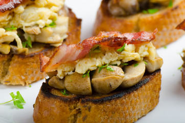 Rustic breakfast - bread toast, mushrooms, eggs