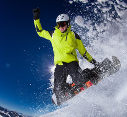 Snowboarder in high mountains