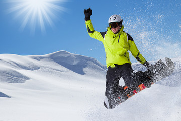 Snowboarder in high mountains