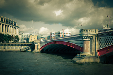 Vintage toned Black Friars Bridge over the Thames in London