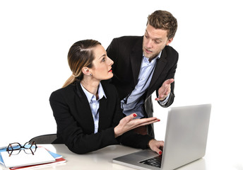 woman working at computer arguing with work colleague in stress