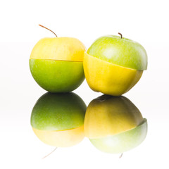 Juicy yellow and green apples sliced