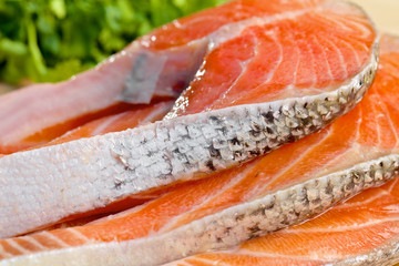 Delicious  portion of fresh salmon fillet with vegetables on