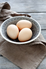 Bio eggs in a bowl on napkin