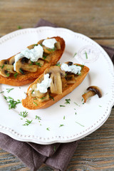 Delicious bruschetta with mushrooms