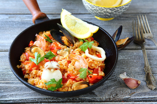 Paella with rice and seafood