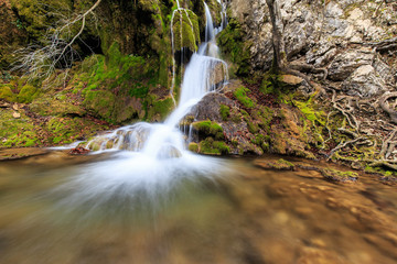 Fototapeta premium Beautiful waterfalls and autumn foliage in the forest