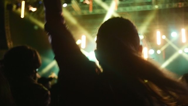 People dancing at open air rock festival