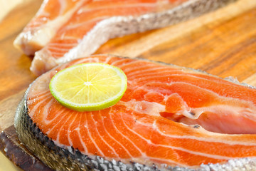 Delicious  portion of fresh salmon fillet with lemon