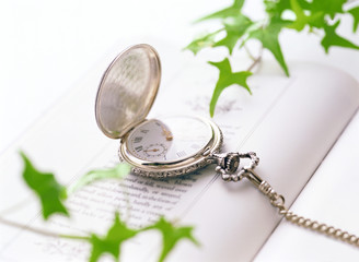 pocket watch and book