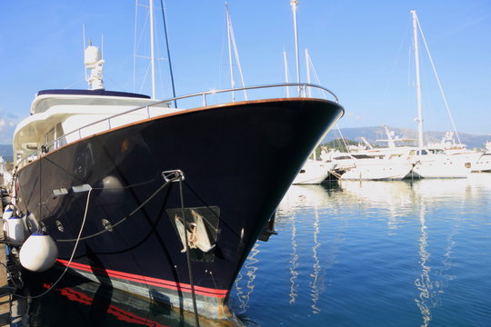 blue Super Yacht Bow in marina	