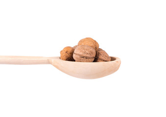 Wooden spoon with walnuts